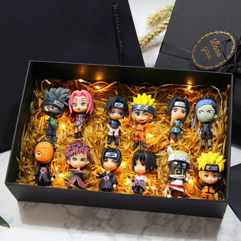 Six chibi-style Naruto mini figures including Sasuke, Gaara and Uchiha Madara on themed bases